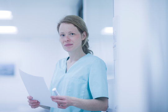 Portrait of radiologist, holding document