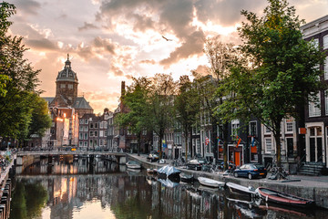 sunrise on the streets and canals of amsterdam