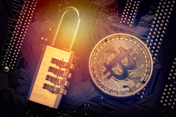 Bitcoin with padlock on computer motherboard. Crypto currency Internet data privacy information security concept.