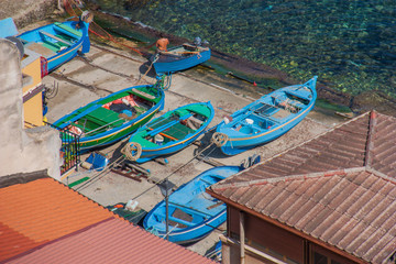 Fototapeta na wymiar Laying just in front of Sicily, Scilla is one of the most beautyful seaside villages of Italy. The village of Chianalea, Castello Ruffo, the golden sand and blue water, make Scilla a jewel