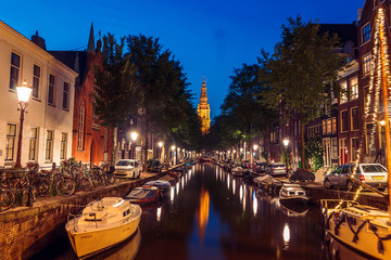 Evening building on the streets and amsterdam channels with illumination