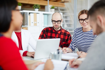 Business team of employees having a meeting. They are discussing future plans