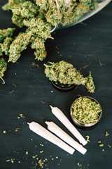 marijuana with trichomes and weed Joint Macro of cannabis buds crushed weed on a black table insta...