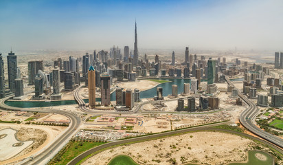 Aerial view of Dubai downtown, panoramic view from airplane window.