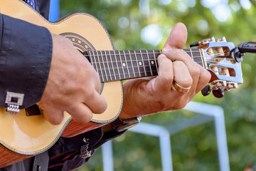 Live musical performance of Brazilian popular music called chorinho with little acoustic guitar...