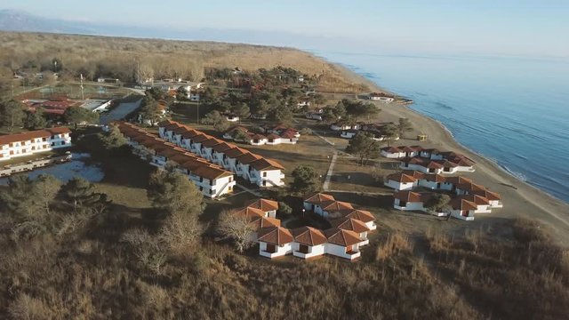Aerial view of  small green village from above near lake in Montenegro
