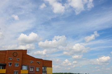 Fototapeta premium Minimal city scenery brick building cloudy sky summer sun