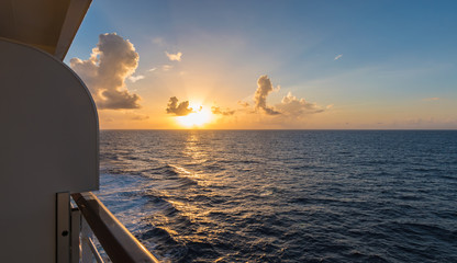 Fototapeta premium Cruise ship deck at sunset over the Pacific Ocean.