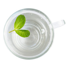 Natural drink - pure mint water. Top view, Glass with fresh green mint leaves. Isolated on white. For your design. Closeup.