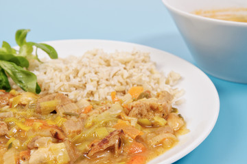 China of soy noodles and leek with rice on a white