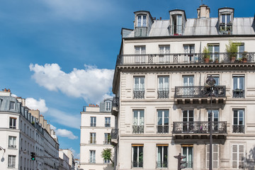 Fototapeta na wymiar Paris, beautiful buildings, typical parisian facades with balcony