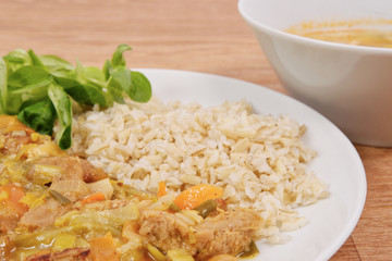 China of soy noodles and leek with rice on a white