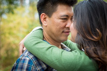 Couple embraces on the road.