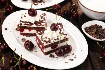 Chocolate cake with cherries and whipped cream. Black Forest cake