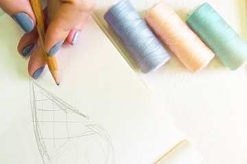 Woman is engaged in creative activity. Making brooch