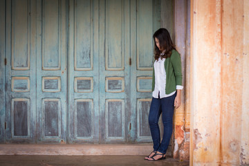 Depressed women. Asian beautiful girl  sadly on the cement floor in ancient houses.