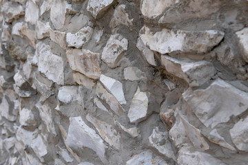 Old stone wall background texture close up