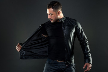 Bearded man undress leather jacket. Man with beard on unshaven face. Fashion model in casual style...