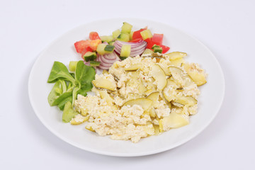 Baked zucchini vegetable salad on a white