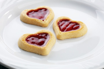 Heart shaped Valentines Day cookies with jam. Shaped biscuit cookie