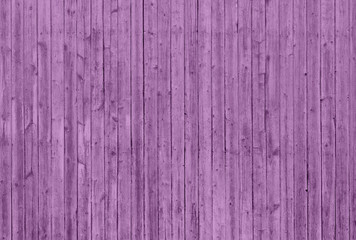 Pink wooden wall with vertical planks