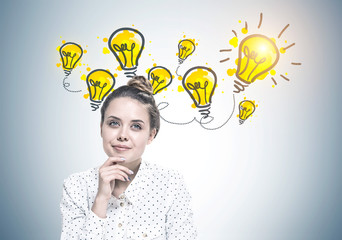 Smiling young woman dreaming, ideas