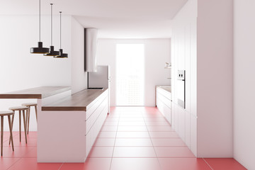 White countertops in a pink floor kitchen, side