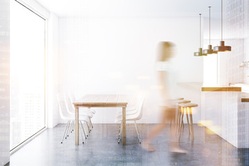 Concrete floor dining room interior, woman