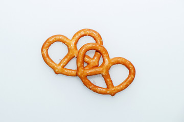 Salted delicious crispy pretzels on a white background