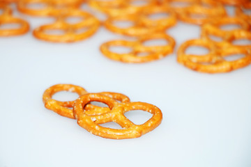 Salted delicious crispy pretzels on a white background