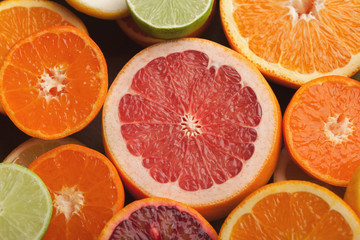 Cut citruses closeup. Juicy background