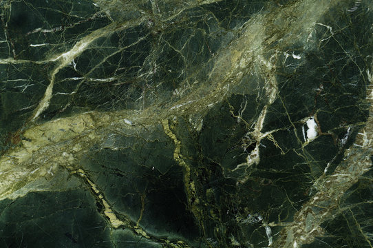 Dark green marble texture with light veins. Perfect natural pattern for background or tile 