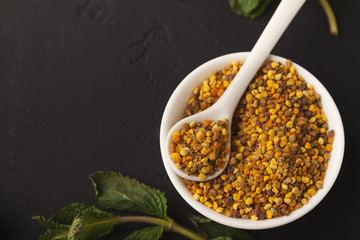 Granules of pollen in boel on black background