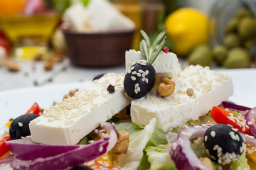 Greek salad with fresh vegetables, feta cheese and black olives