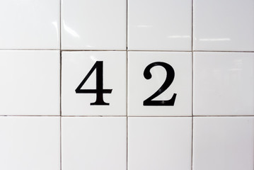 number 42 on ceramic wall tiles