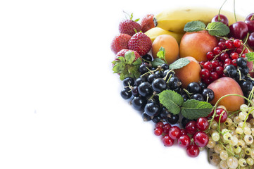Mix fruits berries on white background. Ripe black, red, white currants, strawberries and apricots. Sweet and juicy fruits with copy space for text. Top view.