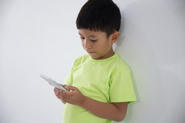 young little boy using smart phone