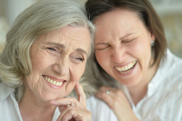 senior mother with adult daughter
