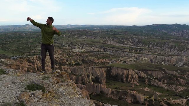 Selfie man. Male taking Self Photo on the Top of Mountain in Cappadocia, Turkey