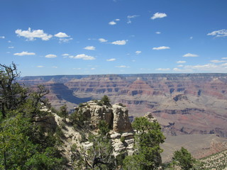 Grand Canyon views as seen from the South Rim Trail on a sunny day with blue sky and some clouds 