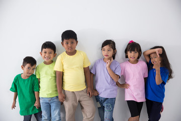 asian kid friends wearing colorful tshirt