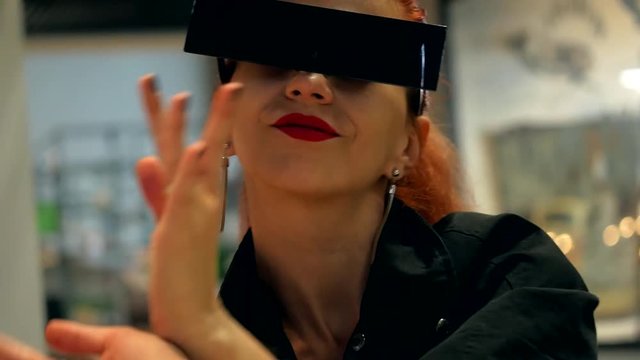 Stylish red hair beautiful woman dancing and has a fun in mall indoor close-up