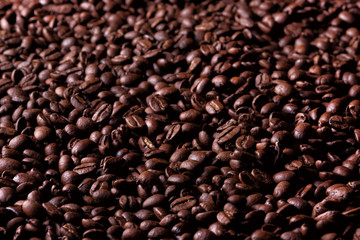 Background of roasted coffee beans. Selective focus