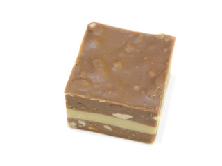 Chocolate candy with nut filling close-up isolated on white background