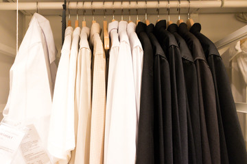 Obraz premium Several shirts are hanging in the wardrobe