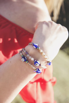Female hand with bead bracelets
