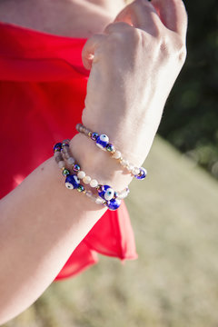 Female hand with bead bracelets