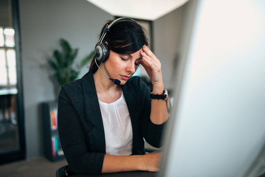 Stressed Female Call Centre Employee.