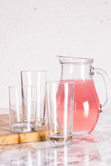 Glass jug and three glasses