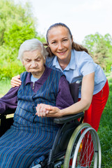 Handicapped woman with caretaker